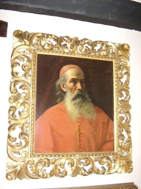 italian school portrait of a cardinal in red robe wearing crucifix in quality florentine carved giltwood frame c180025