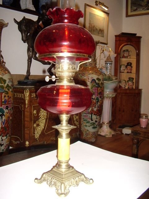 victorian cranberry glass oil lamp with polished brass marble stem c1850