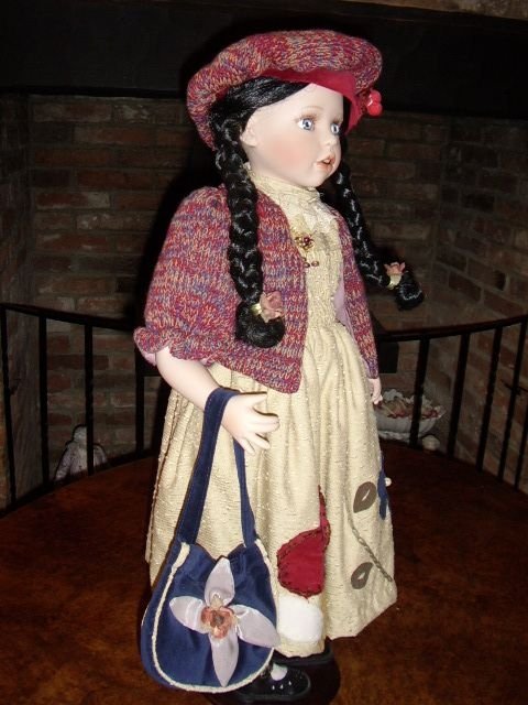 quality hand made porcelain collectors doll holding bag 28 inches high