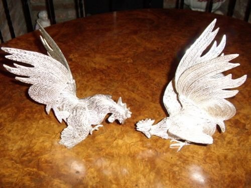 pair of continental solid chromium silver plated table cockrells ready to fight