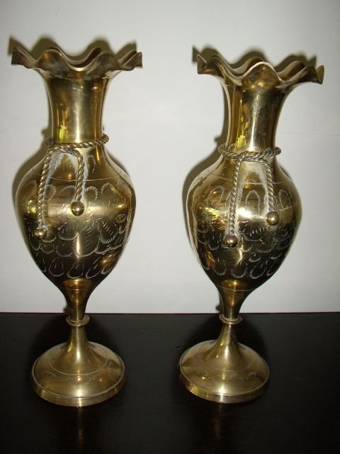 pair of polished brass turned vases with fluted necks rope ties