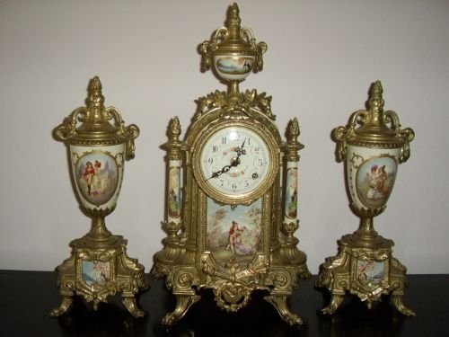 ormolu clock set with painted porcelain panels garnitures