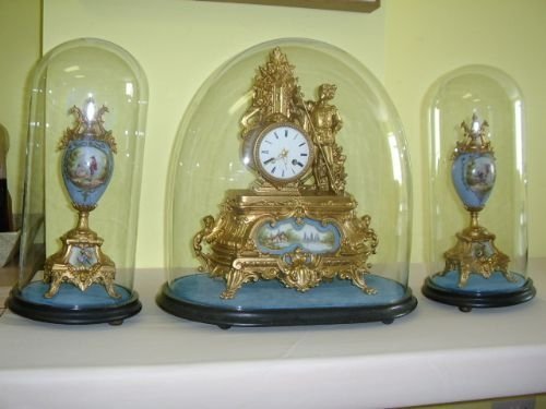 french gilt clock set under glass domes c185060