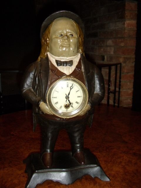 novalty cast metal painted figurine clock with moving eyes stamped underneath bradley hubbard