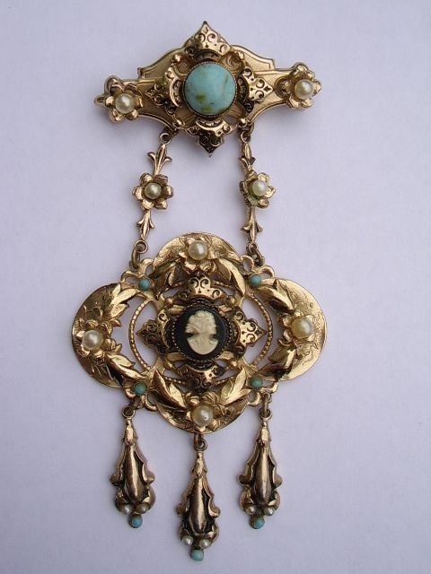 a magnificent rolled gold early victorian cameo ladies pendant broach decorated with leafed foliage set with pearls cabochon turquoise blue stones
