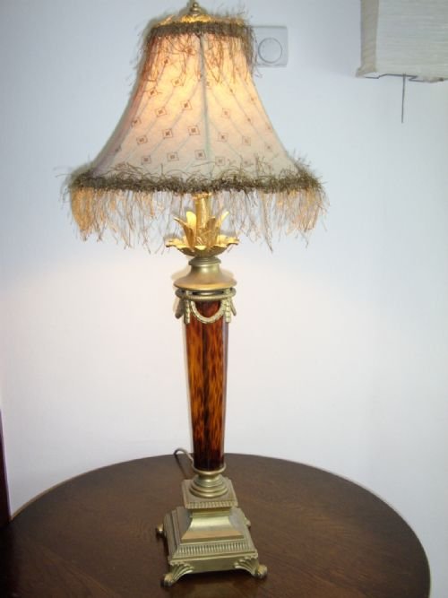 art deco style table lamp with amber glass stem cast metal gilt base