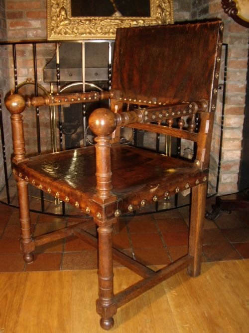 arts crafts oak directors desk chair finished in dark brown leather studded with decorative brass studs c18651900