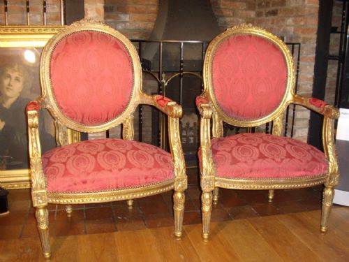 pair of carved gilt salon armchairs
