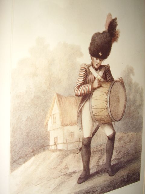 early 19th century chromolithograph of a drummer boy first published london july 20th 1791 later printed by macklin of 39 fleet st london reframed under glass measuring 17 x 225 inches