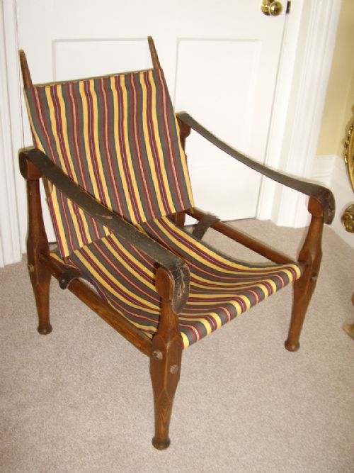 oak campaign or safari chair being dismantable recently reupholstered c1910