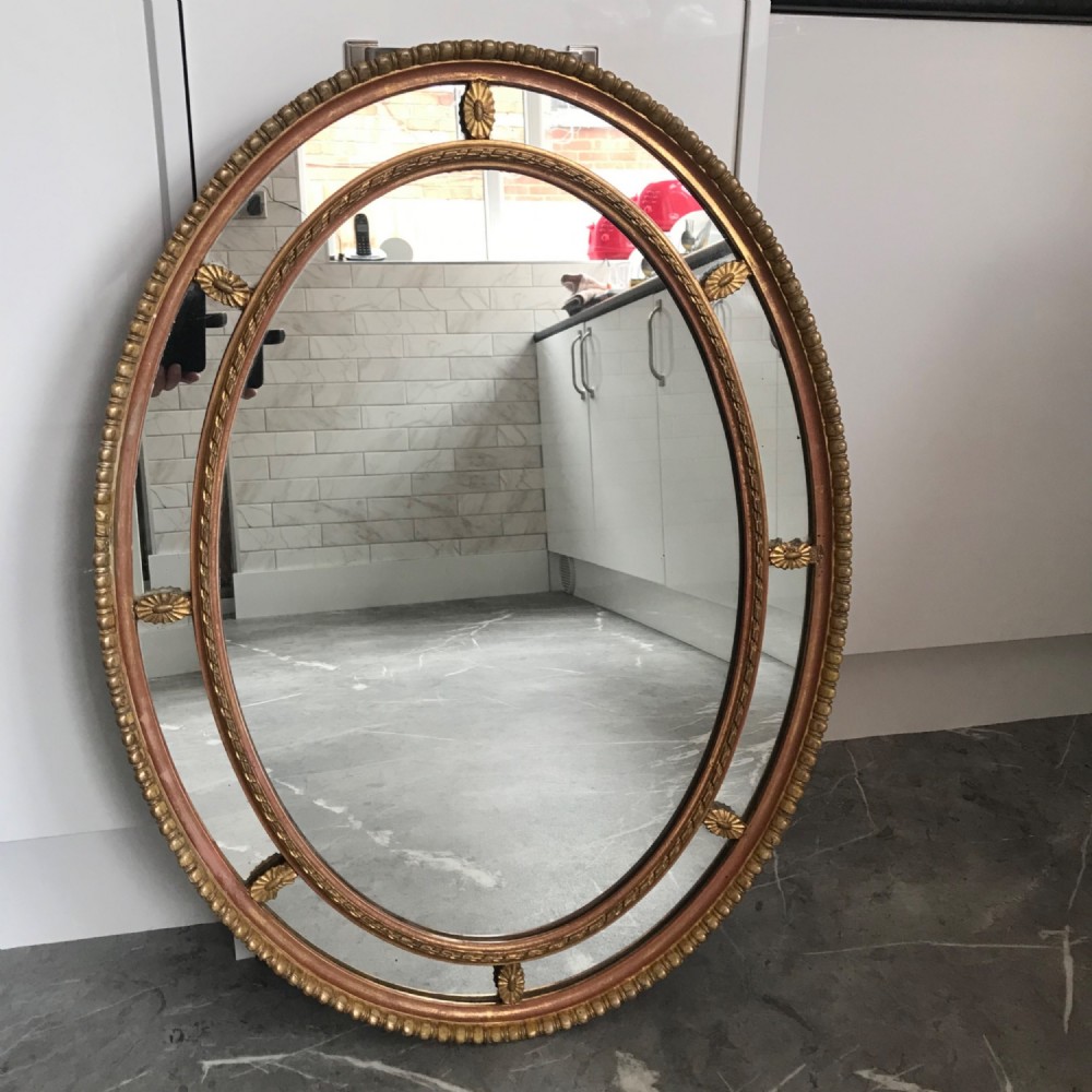 oval mirror late victorian decorative sectional gilt gesso frame with patera flower rosettes and gadrooned edging
