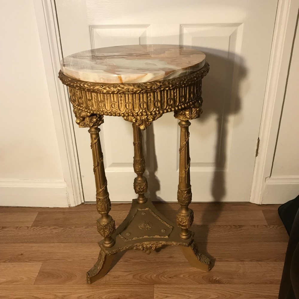 wine table 19th french round onyx top gilt column supports decorative flower mouldings
